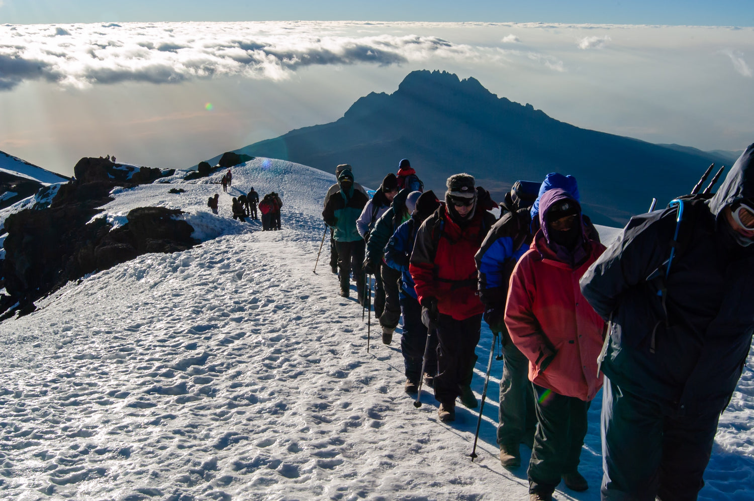 Mt Kilimanjaro climb with Fear Naught snowy mountain top with trekkers